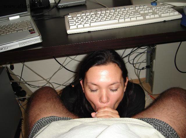 Lovely Wife Sucks Husbands Cock under the Desk Hot Photo