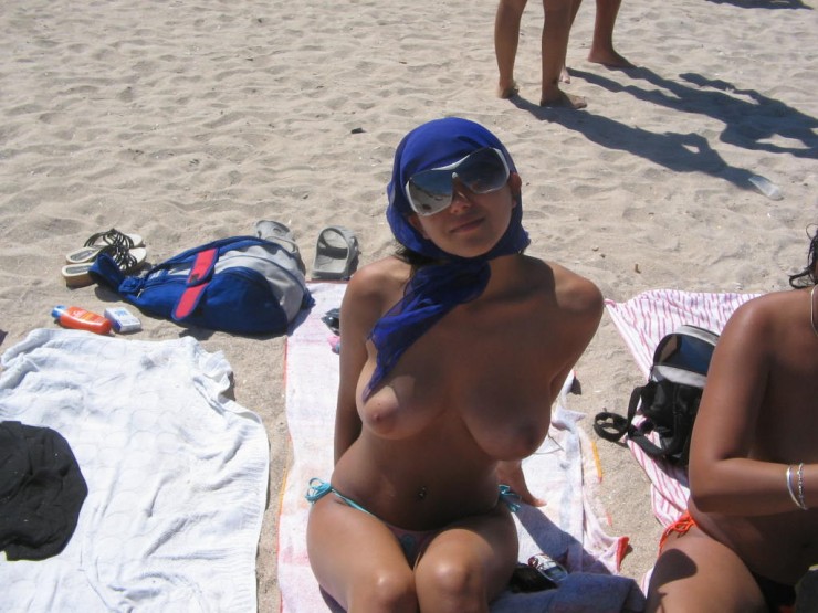 Cute Woman Topless With Friends At Beach Photo